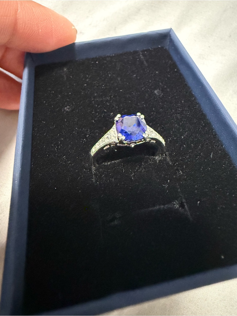 Lab created blue sapphire ring with diamond accent